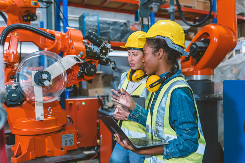 Women engineer worker working team training together at work in