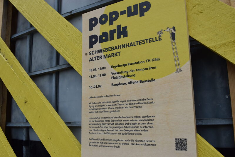 Ein Schild informiert über den Pop-Up-Park