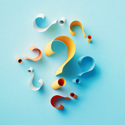 Yellow Question Mark Surrounded By Colorful Question Marks On Blue Background