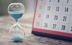 Hour glass and calendar important appointment date, schedule and deadline